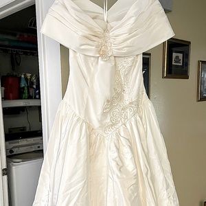 Ivory colored size 10 floor length wedding dress